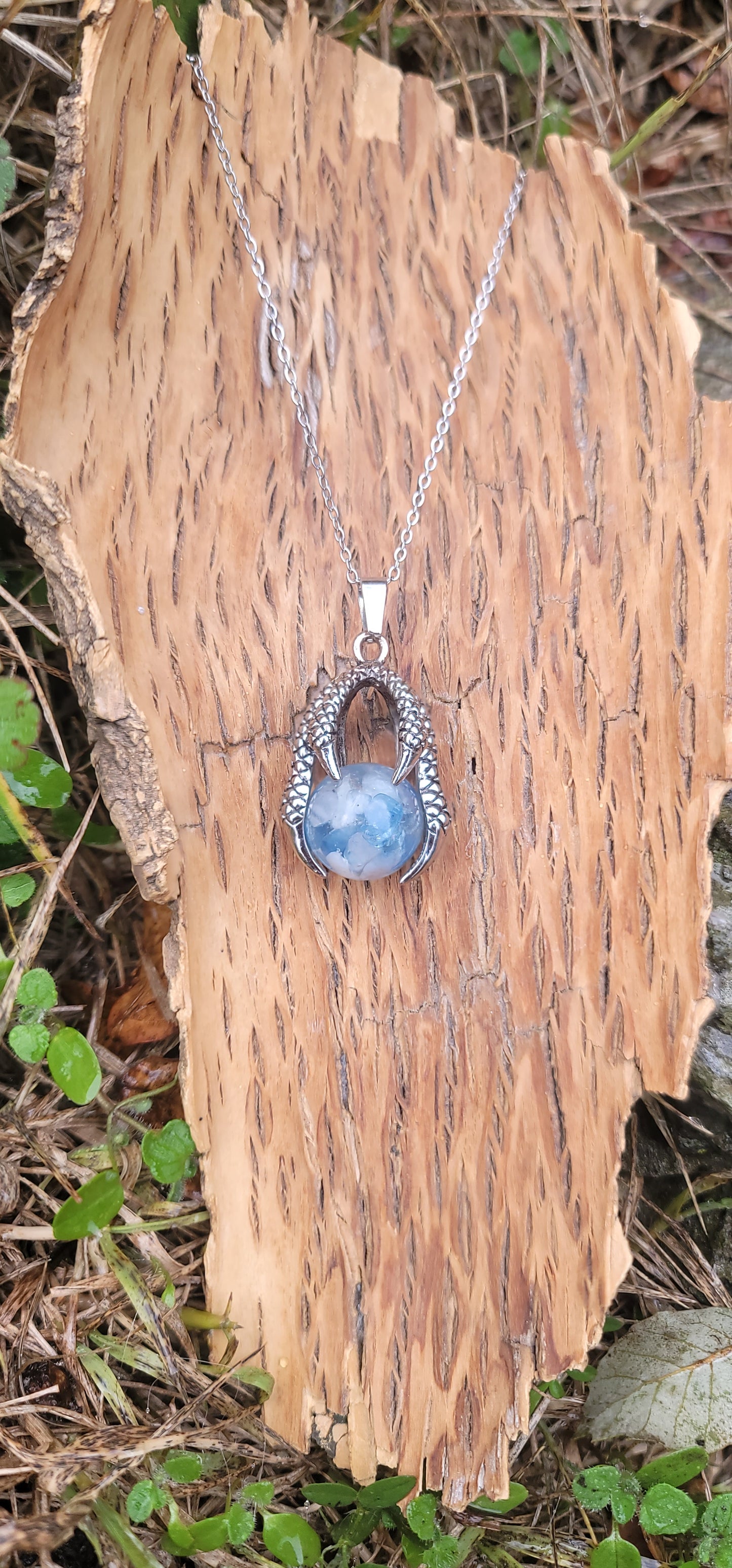 Pendentif "Bonheur" en Aigue marine griffe de dragon